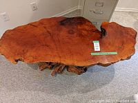 Top-down view of live edge wood slab showing natural edges, grain pattern and lacquer finish
