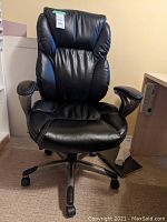 Front view of a black leather Serta office chair showing padded backrest, seat and armrests on wheels.