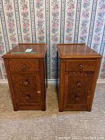 Front view of two solid wood side tables with three drawers each, showing drawer knobs and general design.