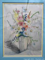 Framed watercolor painting showing a full view of the floral bouquet in a vase with pastel colors and a multicolored mat inside the frame.