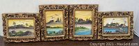 Full view of four miniature oil paintings in ornate carved wooden frames with landscapes.