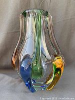Front view of the multicolor Rhapsody glass vase showing the applied colored glass accents and clear glass body.