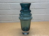 Front view of the blue glass Waterford vase showing its distinctive ring design and flared rim.