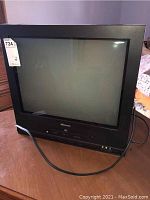 20 inch black CRT TV model MVD2059D-BLK showing full front view with power cord.
