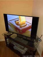 Vizio 40-inch TV powered on displaying an image showing screen working.