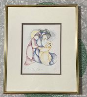 Full front view of framed lithograph on surface