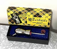 Photo of chrome Mr. Bartender pouring jigger spout inside original box with foam insert.