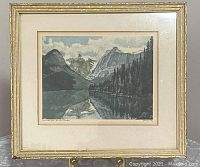 Full view of framed aquatint print depicting Emerald Lake in the Canadian Rockies with signature and title visible on matting.
