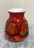 Full front view of the vase showing its shape and glaze design.