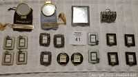 All items in the lot displayed together showing frames, mirrors, and chest.