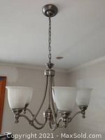 Hanging chandelier installed on ceiling, showing overall size and shape.