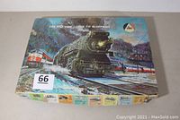 Closed AHM box featuring vintage train artwork and AHM logo, indicating the item is HO scale model train rolling stock.