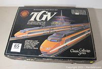 Top of the original box featuring TGV train graphics and brand info