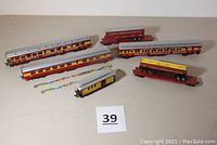 Six HO scale train cars themed around Royal American Shows circus, arranged for visual inspection.