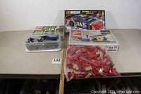 Overview photo showing all five sets including plastic containers, boxed sets, and a large bag of loose blocks.