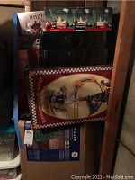 Photo showing stacked boxes including the Christmas tree box, Pfaltzgraff Winterberry candle holders box, and Bonhomme de Neige Christmas light set box.