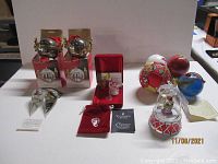Full lot displaying all ornaments and collectibles including boxed items, music box, and glass ornaments.