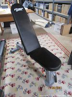 Photo showing black Fitness Gear Pro-Utility Bench with adjustable padded backrest and seat