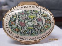 Top view showing detailed miniature garden design and Kipling quote around the lid edge.