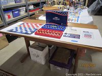 Overview of the chess set laid out on a table showing pieces, board, instructions, and certificate of authenticity.