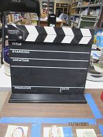 Front view of the video clapper board standing on a table.
