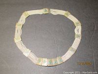 Full view of the multi-strand sterling silver Byzantine necklace with enameled rectangular panels arranged evenly around the necklace.