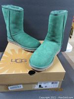 New Ugg Classic Short pine green boots on top of original Ugg box.
