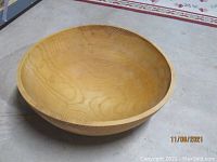 Full view of large wooden salad bowl showing size and wood grain.