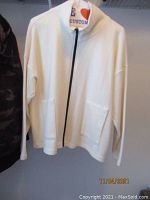 White zip-front sweater with pockets labeled F.H. Clothing Co.