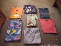 Overview of seven women's clothing items: sampled tees and pajamas.