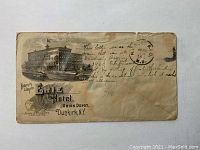 Front side of the aged envelope showing the printed illustration of the Earl Hotel, postal stamp dated August 18, 1900, and handwritten note explaining the train accident near Sandusky Bay.