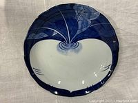 Front view of the blue and white porcelain plate showing giant turnip design