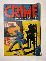 Front cover showing Crime Does Not Pay #42 electrocution scene