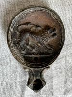 Top view of lamp showing molded lion relief and spout