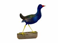 Front left side view of the Purple Gallmule bird decoy, showing the painted blue and purple body, yellow legs, and wooden base.