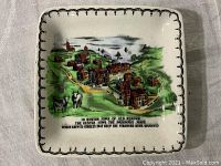 Top view showing the dish's detailed color illustration of Boston cow path, buildings, river, and cows with poem text.