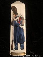 Front view of the ceramic bottle depicting a Grenadier soldier in uniform, rifle resting on shoulder, labeled 'Grenadier'.