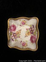 Square white bone china plate with pink and purple flowers and gold trim