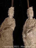 Close-up photo showing detailed porcelain figurine of Chinese woman as part of lamp.