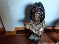Front-right angled view of the Hiawatha chalkware bust showing facial details and beaded necklace.