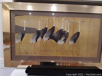 Full view of the framed artwork featuring cranes, showing the overall condition and frame style.