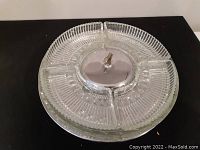 Top view of Kromex glass divided serving tray on chrome base with central knob