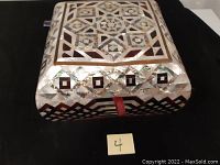 Top and side view of the sewing box showing mother of pearl geometric inlay design.