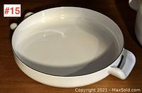 Top view of the white enamelware lidded pot showing interior and handle design.