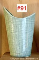 Front view of the light green textured Arabia Finland MCM pottery vase showing its asymmetrical spouted design.