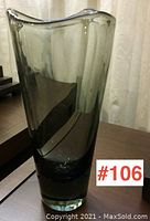 Tall smoky gray handblown glass vase, asymmetrical wavy lip, standing on table