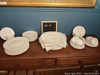 Overall view of entire dinnerware set arranged on table