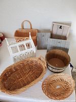 Photo showing entire lot with rustic photo stands, barrel container, various baskets, and terrarium decor.