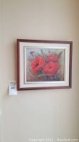 Full view of the framed painting showing three red poppies on canvas wall hang.