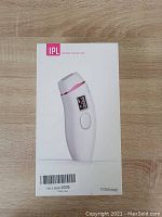 Front view of the unopened box displaying the IPL device image, showcasing brand and IPL label